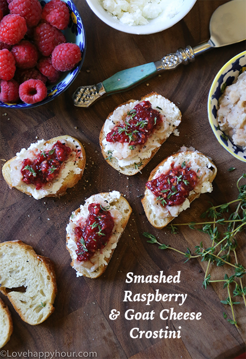 Smashed Raspberry and Goat Cheese Crostinis by Maren Swanson. #appetizer #recipe #goatcheese #raspberry #crostini @lovehappyhour