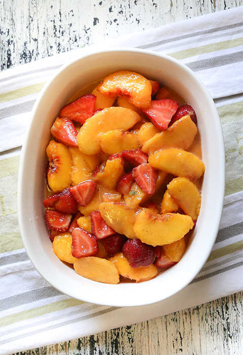 Gooey Peach and Strawberry (+ a shot of Bulleit Whiskey!) Rosemary Crumble by Maren Swanson. #recipe #dessert #peaches #strawberry